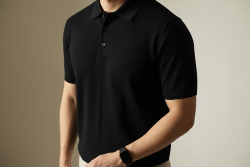 Black t-shirt on a plain background